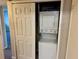 Laundry closet with stackable washer and dryer at 1695 Lee Rd # B211, Winter Park, FL 32789
