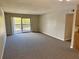 Living room with sliding glass doors to balcony at 1695 Lee Rd # B211, Winter Park, FL 32789