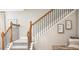 Elegant staircase with wood and metal railings at 1696 Andover Ridge Dr, Deland, FL 32720