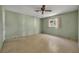 Bedroom with light green walls, ceiling fan, and terrazzo flooring at 1720 Algonquin Trail, Maitland, FL 32751