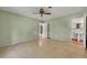 Bedroom with green walls, ceiling fan, and access to bathroom at 1720 Algonquin Trail, Maitland, FL 32751