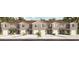 Three-unit townhome building with attached garages and landscaping at 2187 Longleaf Rd, Davenport, FL 33837