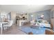 Open living area with coastal decor and access to a patio at 2187 Longleaf Rd, Davenport, FL 33837