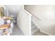 Modern staircase with neutral carpeting and tile flooring at 2187 Longleaf Rd, Davenport, FL 33837