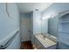 Light blue bathroom with vanity and built-in shelving at 2311 Wekiva Ridge Rd, Apopka, FL 32712