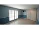 Blue bedroom with window shutters and closet at 2311 Wekiva Ridge Rd, Apopka, FL 32712