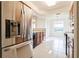 Kitchen with stainless steel refrigerator and wood cabinets at 2579 San Tecla St # 109, Orlando, FL 32835