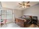 Bedroom with wooden sleigh bed and ceiling fan at 2924 Antique Oaks Cir # 46, Winter Park, FL 32792