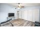 Bright bedroom with wood-look floors, large closet, and TV area at 2924 Antique Oaks Cir # 46, Winter Park, FL 32792