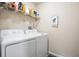 Laundry room with washer, dryer, and shelving at 2924 Antique Oaks Cir # 46, Winter Park, FL 32792