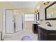 Well-appointed bathroom featuring double vanities, a glass-enclosed shower, and stylish tile flooring at 2961 Cedar Glen Pl, Oviedo, FL 32765