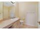 Well-lit bathroom featuring a vanity with a sink, toilet, and a shower/tub combo at 2961 Cedar Glen Pl, Oviedo, FL 32765