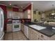 Kitchen boasts ample counter space and wood cabinets at 2961 Cedar Glen Pl, Oviedo, FL 32765