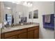 Double vanity bathroom with granite countertops at 3649 Corsica Ln, Clermont, FL 34711