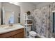 Clean bathroom with shower/tub combo and wood vanity at 3649 Corsica Ln, Clermont, FL 34711