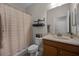 Simple bathroom with shower, toilet and wood vanity at 3649 Corsica Ln, Clermont, FL 34711