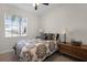 Charming bedroom with a full-size bed and window seat at 3649 Corsica Ln, Clermont, FL 34711