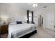 Spacious bedroom with king bed, en-suite bathroom access at 3649 Corsica Ln, Clermont, FL 34711