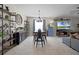 Elegant dining area with a rustic table and modern chandelier at 3649 Corsica Ln, Clermont, FL 34711