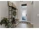 Inviting entryway with tiled floors and a stylish storage unit at 3649 Corsica Ln, Clermont, FL 34711