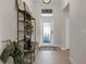 Inviting entryway with tiled floors and a stylish storage unit at 3649 Corsica Ln, Clermont, FL 34711