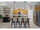 Kitchen features island with seating and wood cabinets at 3649 Corsica Ln, Clermont, FL 34711