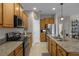 Kitchen features stainless steel appliances and granite countertops at 3649 Corsica Ln, Clermont, FL 34711