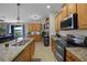 Modern kitchen with island and stainless steel appliances at 3649 Corsica Ln, Clermont, FL 34711