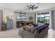 Spacious living room with comfortable seating and large TV at 3649 Corsica Ln, Clermont, FL 34711