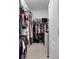 Large walk-in closet with ample shelving and hanging space at 3649 Corsica Ln, Clermont, FL 34711