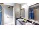 Bathroom boasts double sinks, a large mirror, and a shower at 3917 Derby Dr, Lakeland, FL 33809