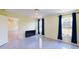 Bedroom with tile floors, large windows, and views of nature at 3917 Derby Dr, Lakeland, FL 33809