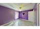 Purple bedroom featuring a ceiling fan and heart mirror at 3917 Derby Dr, Lakeland, FL 33809