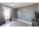 Gray bedroom with ceiling fan and window coverings at 3917 Derby Dr, Lakeland, FL 33809