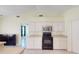 Kitchen with ample cabinet space and black appliances at 3917 Derby Dr, Lakeland, FL 33809