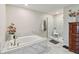 Elegant bathroom with soaking tub and walk-in shower at 394 Singing Tree Ln, Winter Springs, FL 32708