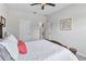 Bedroom with a wooden bed frame, carpeted floors, and access to a hallway at 394 Singing Tree Ln, Winter Springs, FL 32708