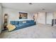 Spacious bonus room featuring a sectional sofa and ample natural light at 394 Singing Tree Ln, Winter Springs, FL 32708