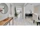 Spacious entryway with tile floors, console table, and views into the living and dining areas at 394 Singing Tree Ln, Winter Springs, FL 32708