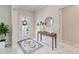 Bright entryway with tile floors, a console table, and a large mirror at 394 Singing Tree Ln, Winter Springs, FL 32708