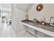 Bright entryway with built-in desk and view of dining area at 394 Singing Tree Ln, Winter Springs, FL 32708