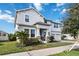 Two-story house with white siding, stone accents, and a two-car garage at 394 Singing Tree Ln, Winter Springs, FL 32708