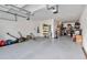 Spacious garage with ample storage shelving and room for two cars at 394 Singing Tree Ln, Winter Springs, FL 32708