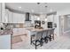 Modern kitchen with white cabinets and a large island at 394 Singing Tree Ln, Winter Springs, FL 32708