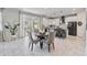 Eat-in kitchen with white cabinets and view to backyard at 394 Singing Tree Ln, Winter Springs, FL 32708