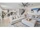 Open living space with sectional sofa and kitchen views at 394 Singing Tree Ln, Winter Springs, FL 32708
