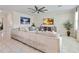 Bright living room with a sectional sofa and large windows at 394 Singing Tree Ln, Winter Springs, FL 32708