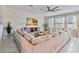 Spacious living room featuring a large sectional sofa and a flat-screen TV at 394 Singing Tree Ln, Winter Springs, FL 32708