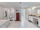 Spa-like bathroom with soaking tub, walk-in shower, and double vanity at 394 Singing Tree Ln, Winter Springs, FL 32708