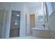 Bathroom features a double vanity, and access to bedroom and laundry at 4911 Santa Clara Dr, Orlando, FL 32837